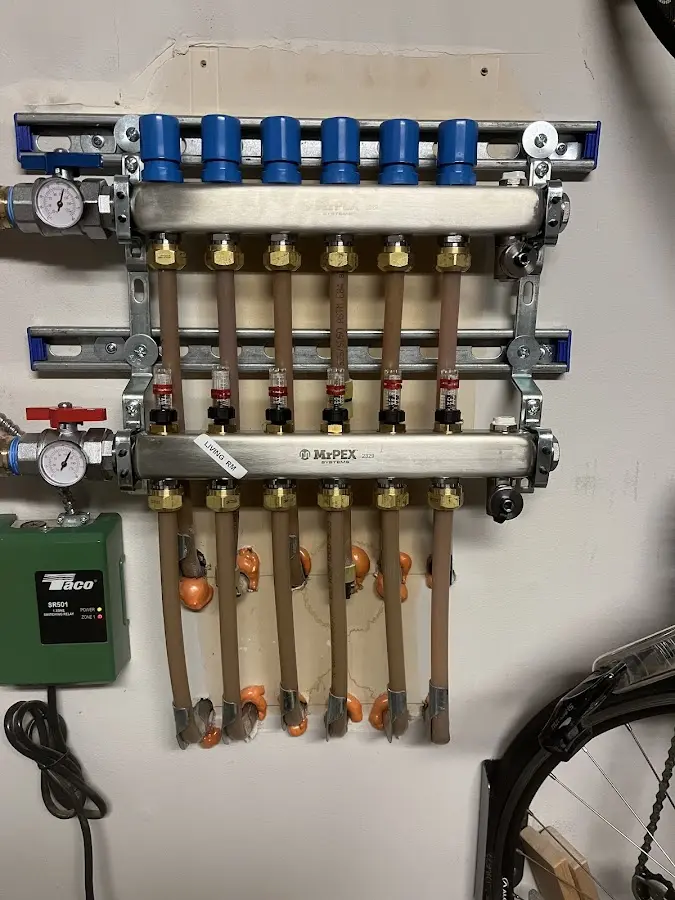 Plumber performing Water Heater Repair at a residential property in East Windsor